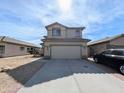 Exterior view of a two-story home with a driveway and attached two-car garage at 8861 W Paradise Dr, Peoria, AZ 85345