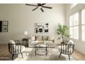 Inviting living room with stylish seating, modern art, and ample natural light at 9224 E Windrose Dr, Scottsdale, AZ 85260