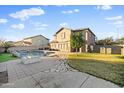 Spacious backyard with a pool, waterfall, stone walkway, and lush landscaping at 925 E Doris St, Avondale, AZ 85323