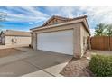 Spacious two car garage with large driveway and desert landscaping at 1165 W 4Th Ave, Apache Junction, AZ 85120