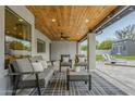 Covered patio area featuring seating, a ceiling fan, and view of backyard at 11942 N 95Th St, Scottsdale, AZ 85260