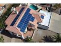 Aerial view of home featuring solar panels, tile roof, and paved patio with fountain at 14401 N 29Th St, Phoenix, AZ 85032