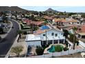 Aerial view of a home with solar panels, balcony, and refreshing swimming pool at 14401 N 29Th St, Phoenix, AZ 85032