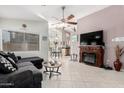 Comfortable living room featuring a cozy fireplace and an open layout at 1847 E Milky Way, Gilbert, AZ 85295