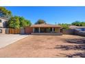 Charming single-story home with a welcoming front porch and a well-maintained yard at 2217 N 37Th Pl, Phoenix, AZ 85008