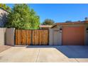 Close up showing the garage, gate and front entrance of the residence at 2217 N 37Th Pl, Phoenix, AZ 85008