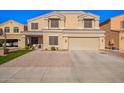 Two-story home boasting a well-maintained front yard and a spacious three-car garage at 23510 N 25Th St, Phoenix, AZ 85024