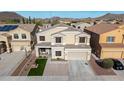 Charming two-story home featuring neutral stucco, landscaped front yard, and an attached two-car garage at 23510 N 25Th St, Phoenix, AZ 85024