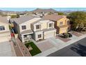 Desirable two-story home featuring a cozy front porch and a perfectly sized front yard at 23510 N 25Th St, Phoenix, AZ 85024