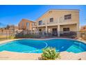 Backyard oasis with a refreshing pool and covered patio, ideal for outdoor entertaining at 23510 N 25Th St, Phoenix, AZ 85024