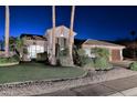 Charming single-story home featuring desert landscaping, manicured grass, and a tile roof at 24024 N 74Th St, Scottsdale, AZ 85255