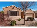 Single-story home featuring low-maintenance desert landscaping and an attached two-car garage at 29247 N Bauxite Ln, San Tan Valley, AZ 85143