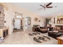 Inviting living room featuring tile flooring, neutral walls, and an open floor plan at 29247 N Bauxite Ln, San Tan Valley, AZ 85143