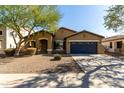 Charming single-story home featuring a well-maintained landscape and a two-car garage at 3233 N 137Th Dr, Avondale, AZ 85392