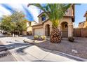 Attractive two-story residence showcasing a manicured yard with mature trees and a two-car garage at 3235 E Virgil Dr, Gilbert, AZ 85298