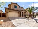 Inviting two-story home featuring a spacious driveway and well-manicured desert landscaping at 3235 E Virgil Dr, Gilbert, AZ 85298