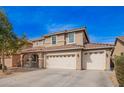 Beautiful two-story home featuring a three-car garage, tiled roof, and neutral color scheme at 3532 E Alfalfa Dr, Gilbert, AZ 85298