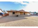 Traditional brick home with desert landscaping and a two-car garage at 3635 W Cortez St, Phoenix, AZ 85029