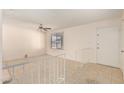 Bright living room featuring tile flooring, ceiling fan, and a staircase at 3635 W Cortez St, Phoenix, AZ 85029