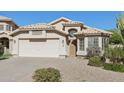 Beautiful home with a two-car garage, desert landscaping, and bay window at 3804 E Encinas Ave, Gilbert, AZ 85234