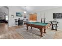 Entertainment room featuring a pool table, dart board, and stylish wet bar at 3804 E Encinas Ave, Gilbert, AZ 85234