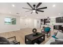 Spacious living room with ample natural light and an open floor plan flowing into the updated kitchen at 42 E 14Th St, Mesa, AZ 85201