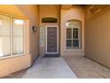 Inviting front entrance showcasing a decorative security door and sidelight windows at 5009 E Baker Dr, Cave Creek, AZ 85331