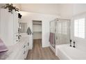 Bright and spacious bathroom featuring a soaking tub and modern fixtures at 5624 E Garnet Ave, Mesa, AZ 85206