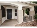 Inviting entryway with elegant arches, offering a warm welcome at 5624 E Garnet Ave, Mesa, AZ 85206