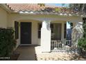 Charming front porch with a cozy bench and security door for added peace of mind at 5624 E Garnet Ave, Mesa, AZ 85206