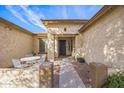 Inviting entryway with a cozy seating area and a well-maintained exterior at 5634 N 82 Ave, Glendale, AZ 85303