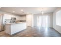 Open-concept kitchen with stainless steel appliances and a view of the dining area at 821 S Parker Pl, Casa Grande, AZ 85122