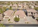 Aerial shot of neighborhood streets and homes that offers a view of well-kept landscape at 856 E Indian Wells Pl, Chandler, AZ 85249