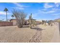 Beautiful desert-landscaped front yard with rock accents and a view of blue skies at 9410 N 18Th St, Phoenix, AZ 85020