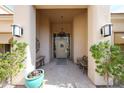 Inviting front porch with bench and decorative plants at 10125 N 78Th Pl, Scottsdale, AZ 85258