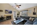 Cozy living room featuring a fireplace, comfortable seating, and natural light at 1222 W Baseline Rd # 114, Tempe, AZ 85283