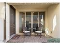 Outdoor seating area with a table and chairs is conveniently situated near the sliding glass door at 1929 S Follett Way, Gilbert, AZ 85295