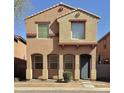 Charming two-story home with a blue front door, arched entry and a small front yard at 2019 N 78Th Ave, Phoenix, AZ 85035