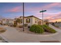 Corner lot home boasts tidy landscaping, a two-car garage, and sidewalk access at the intersection of Silver Creek Ln at 22837 E Silver Creek Ln, Queen Creek, AZ 85142