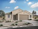 Charming single-story home featuring desert landscaping, a two car garage and modern design accents at 34440 N Timberlake N Mnr, San Tan Valley, AZ 85144