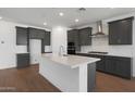 Open kitchen featuring gray cabinetry, stainless steel appliances, and a large island at 34464 N Timberlake N Mnr, San Tan Valley, AZ 85144