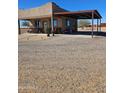 Charming home with a covered carport and inviting curb appeal, perfect for desert living at 35524 N 215Th Dr, Wittmann, AZ 85361