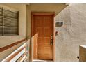 Unit 251 front door with traditional design and hardware at 4850 E Desert Cove Ave # 251, Scottsdale, AZ 85254