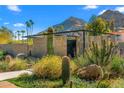 Landscaped front yard showcasing desert plants, block privacy wall and mountain views at 4900 E Arroyo Verde Dr, Paradise Valley, AZ 85253