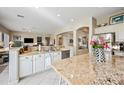 Open-concept kitchen with stainless steel appliances, granite countertops, and open access to the living room at 5323 E Thunder Hawk E Rd, Cave Creek, AZ 85331