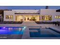 Luxurious backyard with a sparkling pool, hot tub, covered patio, and landscaped surroundings at 86Xx E Stagecoach Pass # 4, Carefree, AZ 85377