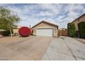 Attractive single-Gathering home with desert landscaping and a two-car garage at 12622 W Avalon Dr, Avondale, AZ 85392