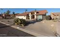 Inviting single-story home featuring desert landscaping, a red tile roof and a welcoming entrance at 17104 E Rand Dr, Fountain Hills, AZ 85268