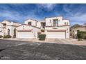 Image of multi-unit building showing attached garages, terracotta roofing and desert landscaping at 1750 E Ocotillo Rd # 11, Phoenix, AZ 85016