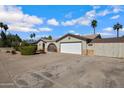 Suburban home featuring desert landscaping, a courtyard entrance, and an attached two-car garage at 1812 W Curry Drive Dr, Chandler, AZ 85224